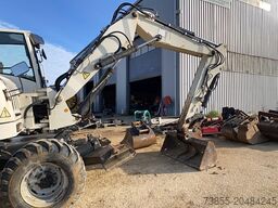 Terex TW110 with two-piece offset boom and 3 buckets