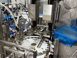 Wick und Schaefer GmbH Rotary Filler with Cap Sorter and Capper
