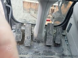 Case WX95 with 4 excavator buckets and forks