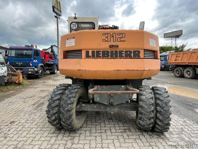 Pelle sur pneus LIEBHERR A 312 Bagger Deutsch Top