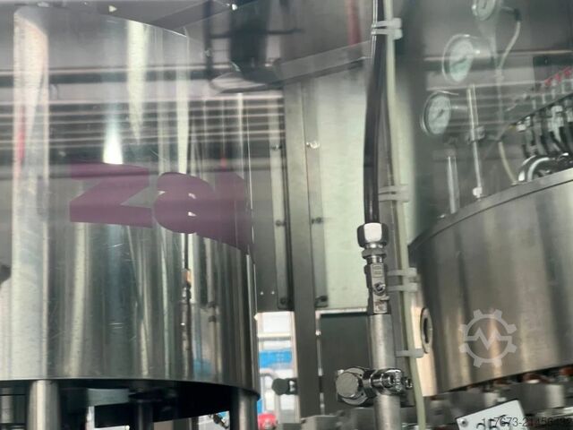 Begagnad KRONES fyllningstriblock för kolsyrat vatten, 25 000 flaskor per timme – tillverkningsår 20 Krones 