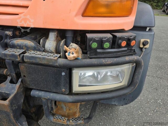 Outro UNIMOG U 500 3-Seiten-Kipper mit Kran PK 9501