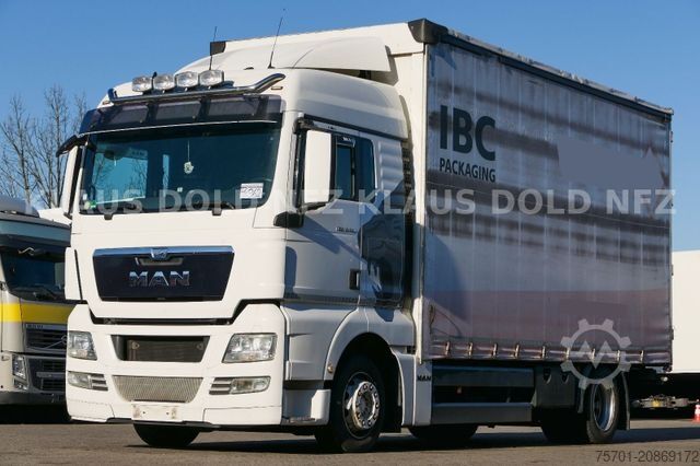 Flatbed truck with tarp MAN TGX 18.400 Pritsche Plane Retarder 2-Tanks