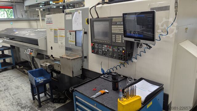Torno CNC com alimentador de barras OKUMA L300-MW