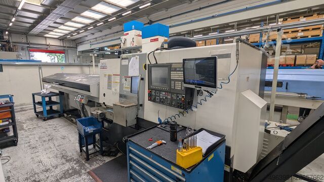 Torno CNC com alimentador de barras OKUMA L300-MW