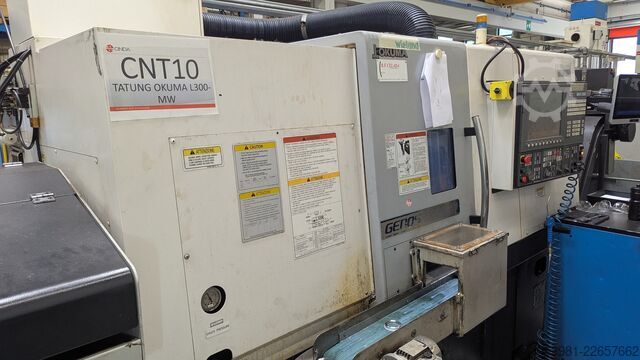 Torno CNC com alimentador de barras OKUMA L300-MW