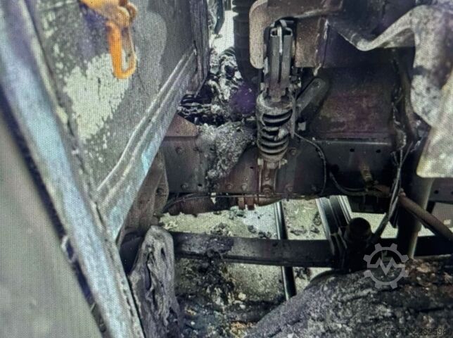 Plattewagen met zeil MAN TGM Brandschaden