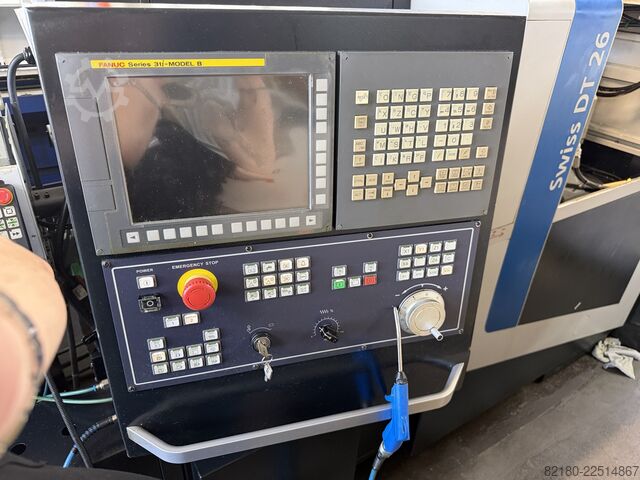 Torno automático de cabezal móvil Tornos Swiss DT 26