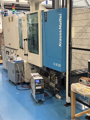 Pressa ad iniezione con robot KraussMaffei KM80SP380CX