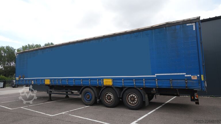 Skjutbara presenningar Kogel 3 axle curtainside trailer with side boards