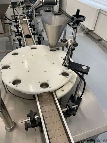 Rotary stroj s postřikovací jednotkou Rotary table with spraying system