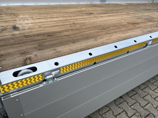 Otwarta przyczepa Möslein THT 11- G 6,2  Tandem Pritsche- Tieflader mit Rungentaschen