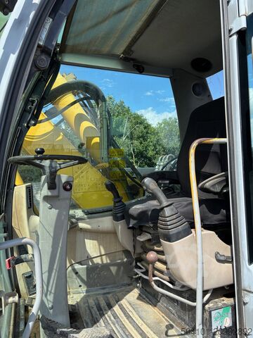 Gumikerekes kotrógép New Holland MH CITY