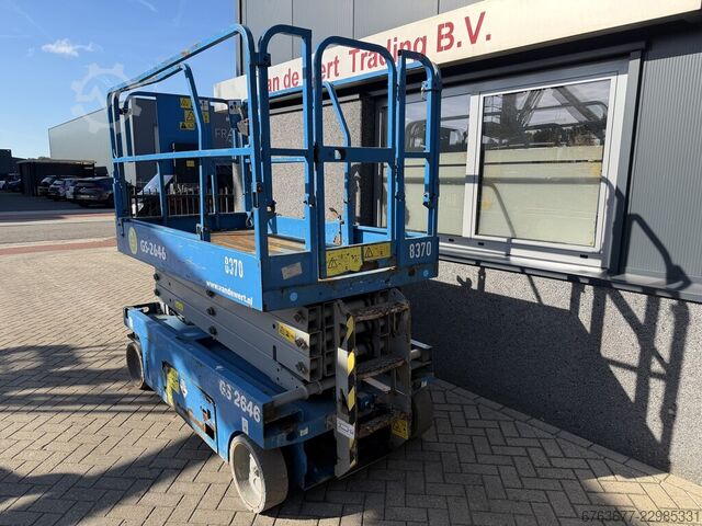 Genie GS - 2646 Ψαλιδωτή ανυψωτική πλατφόρμα / Εργαλειοφόρος πλατφόρμα / Ψαλιδωτό ανυψωτικό με ύψος  GENIE GS - 2646  SchaarHoogwerker / Arbeitsbuhne / Scicc