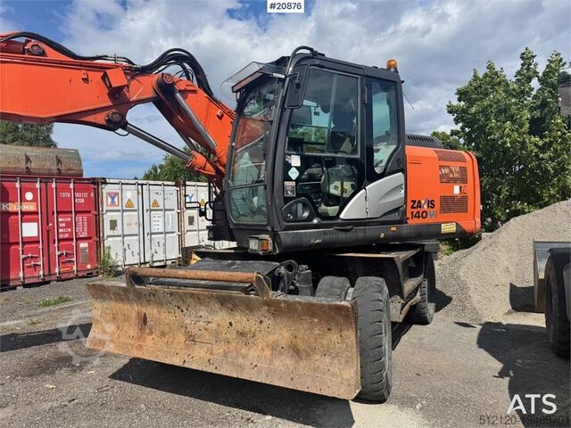 Tekerlekli ekskavatör Hitachi ZX140W-5B Wheeled excavator w/ Rototilt and 2 buck