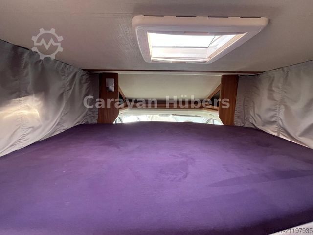 Half-integraal camper CARADO T 348 - Hub/Festbett - Klima - Garage -