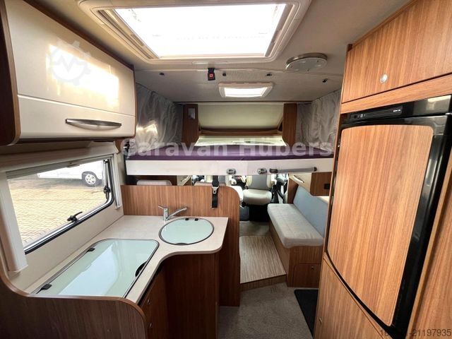 Half-integraal camper CARADO T 348 - Hub/Festbett - Klima - Garage -