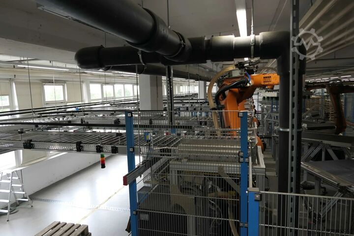 Linia paletyzująca z robotami KUKA KUKA Automatische Palettieranlage