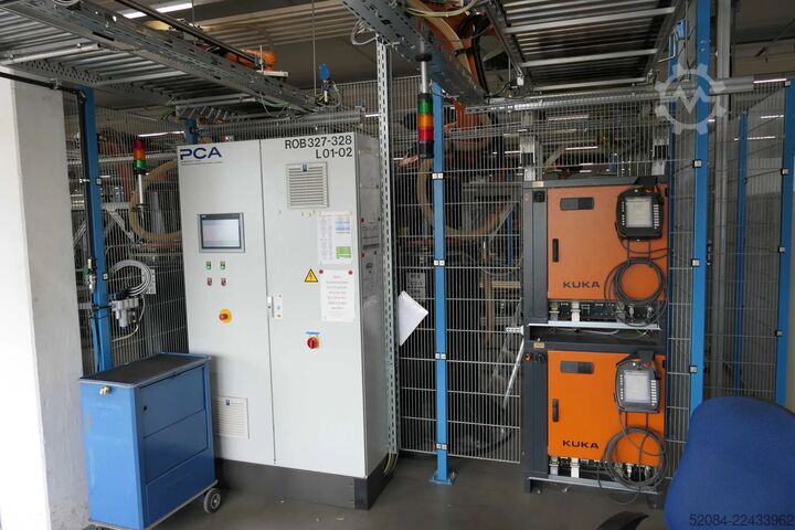 Linia paletyzująca z robotami KUKA KUKA Automatische Palettieranlage