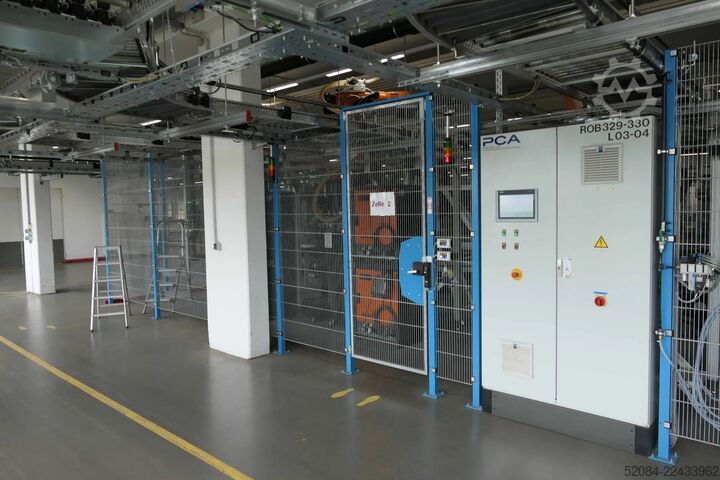 Linia paletyzująca z robotami KUKA KUKA Automatische Palettieranlage