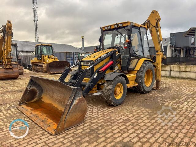 Kombination af gravemaskine og læsser Caterpillar 428C