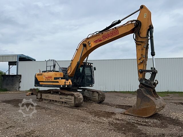 Tracked Excavator Hyundai HX300 NL with a bucket