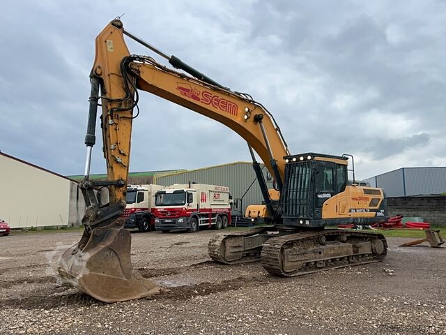 Tracked Excavator Hyundai HX300 NL with a bucket