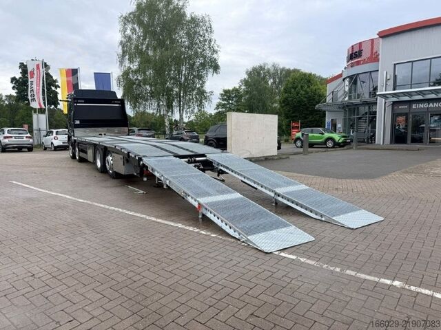 Camion plateau MAN Baumaschinen Maschinentransporter mit Rampen