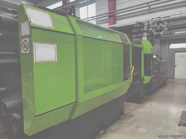 Spuitgietmachine met robot DEMAG 650/1000-5200