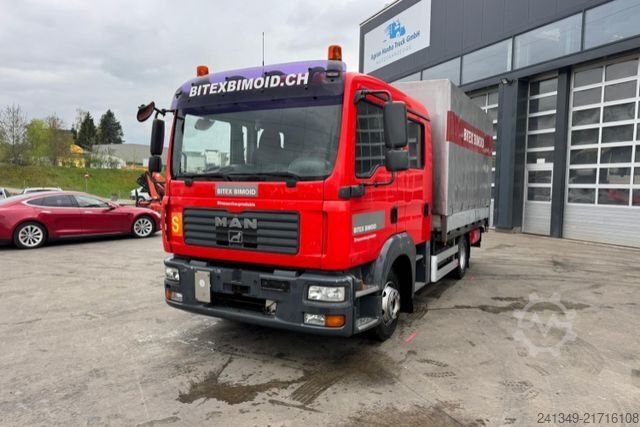 Camion cu platformă și prelată MAN TGL 12.240 4x2 ADR