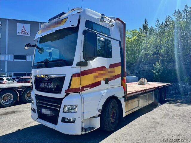Trailer til platform MAN TGX 580 Flatbed truck.