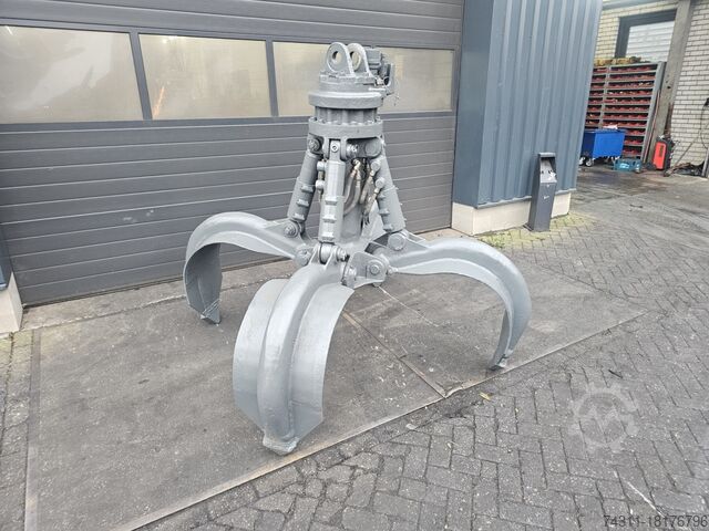 Mobiele graafmachine liebherr gm 64 scrap grab poliepgrijper orange peel