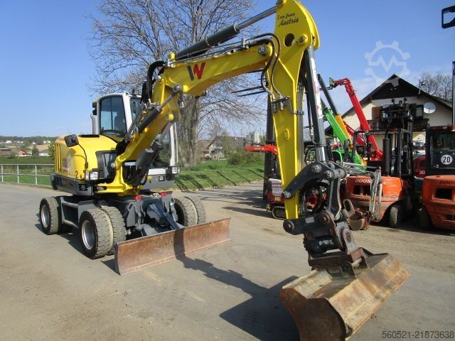 τροχοφόρος εκσκαφέας Neuson EW 65 mit POWERTILT + Schnellwechsler + 3 Löffel