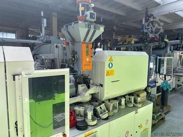 Spuitgietmachine KraussMaffei KM 81-380 PX mit dem Roboter Sepro Indus