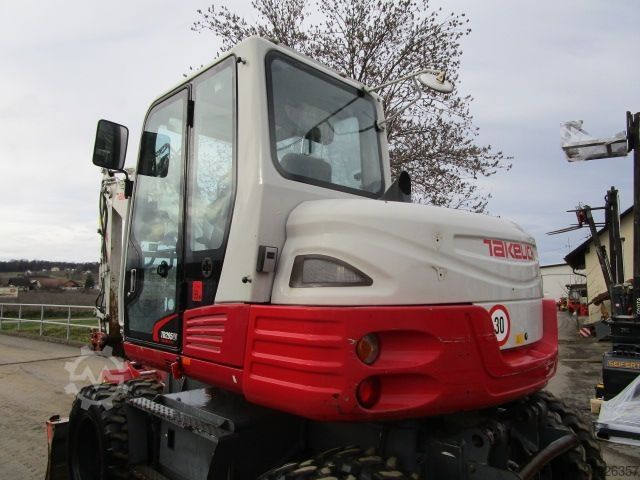 Kolový bagr Takeuchi TB 295W - POWERTILT + Schnellw + 3 Löffel