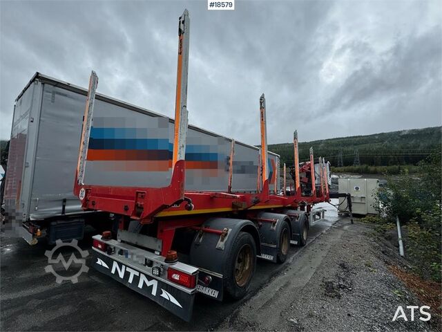 Huttner houttrailer met 17 t/m Epsilon kraan en uitschuifdeel Huttner Timber trailer w/ 17 t/m Epsilon crane and extensi