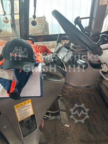 Backhoe loader CASE 695 / Baggerlader Skip / German 1. Hand