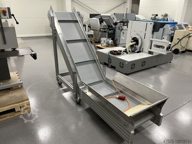 Stansmes Conveyor belt for waste removal from guillotine, three-knife trimmer
