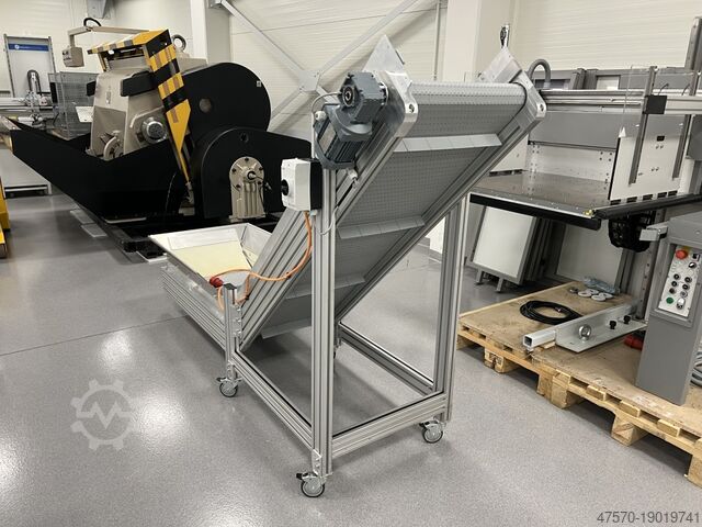 Stansmes Conveyor belt for waste removal from guillotine, three-knife trimmer