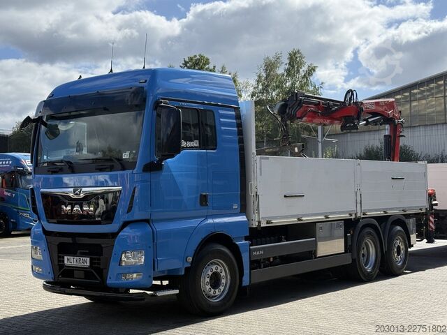 Ciężarówka z płaską platformą MAN TGX 26.470 Euro 6 Abrollkipper mit Ladekran